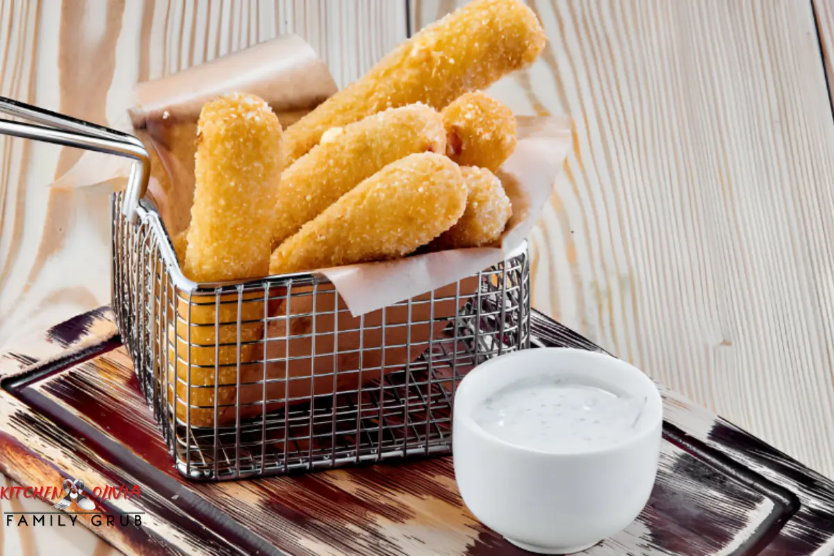 Frozen chicken tenders being cooked in an air fryer.