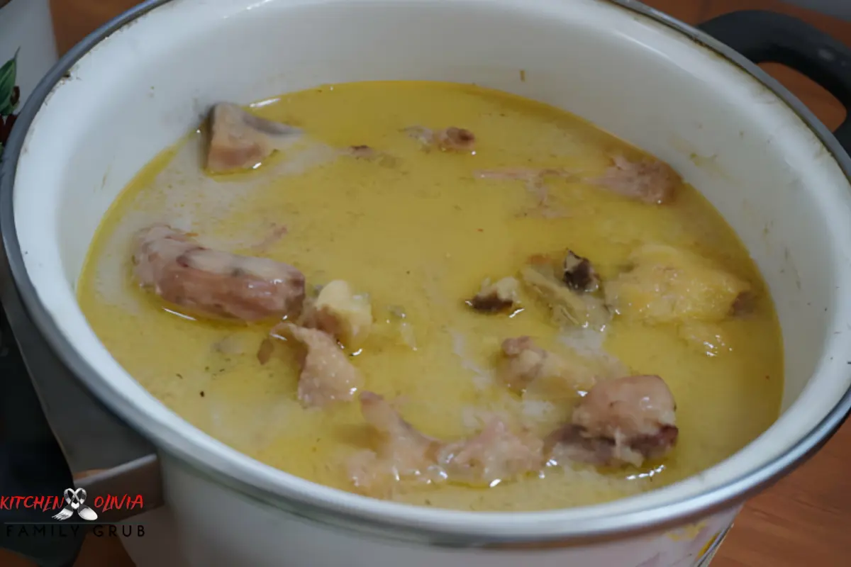 Bowl of Caribbean Chicken Souse with lime and fresh herbs"