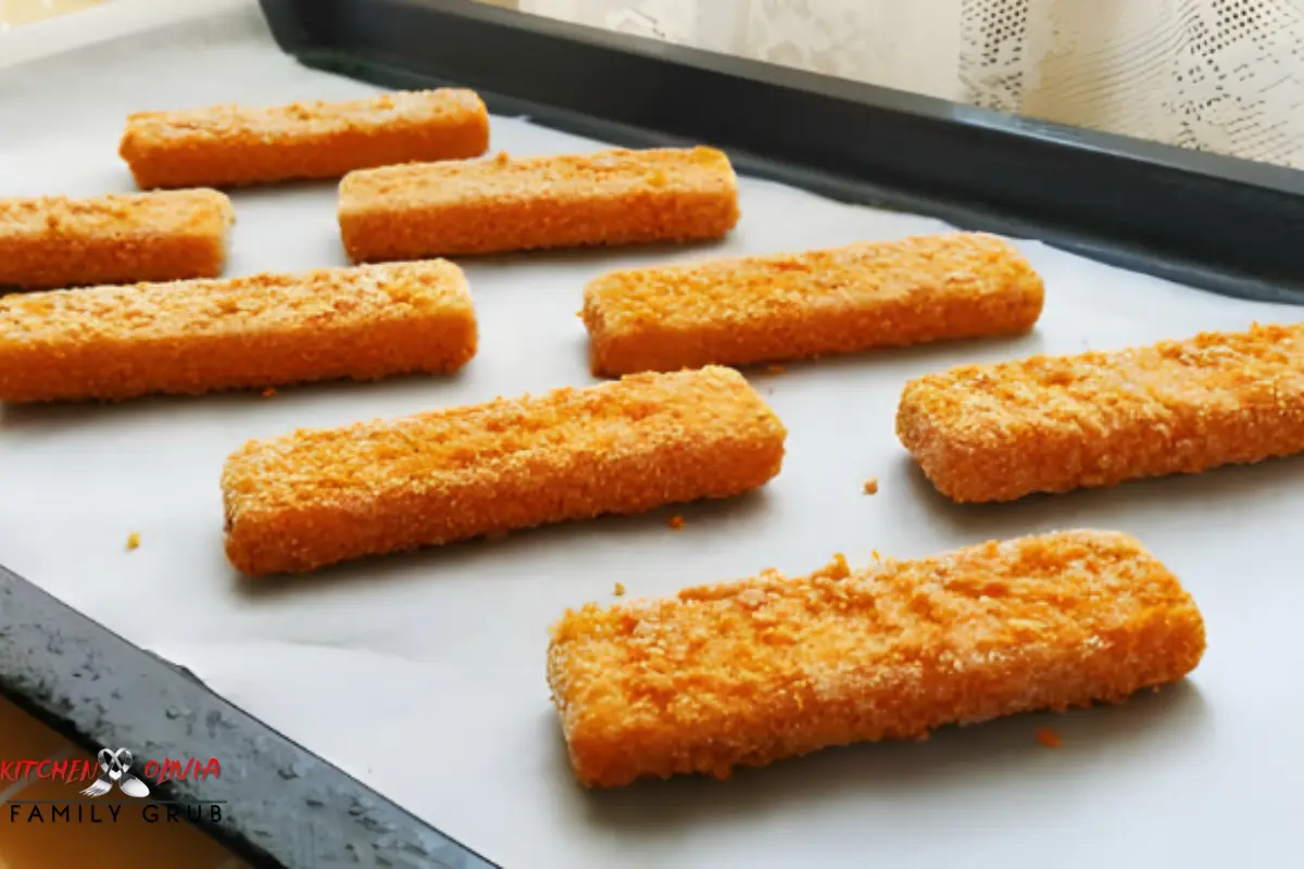 Golden brown chicken nuggets being baked in an oven