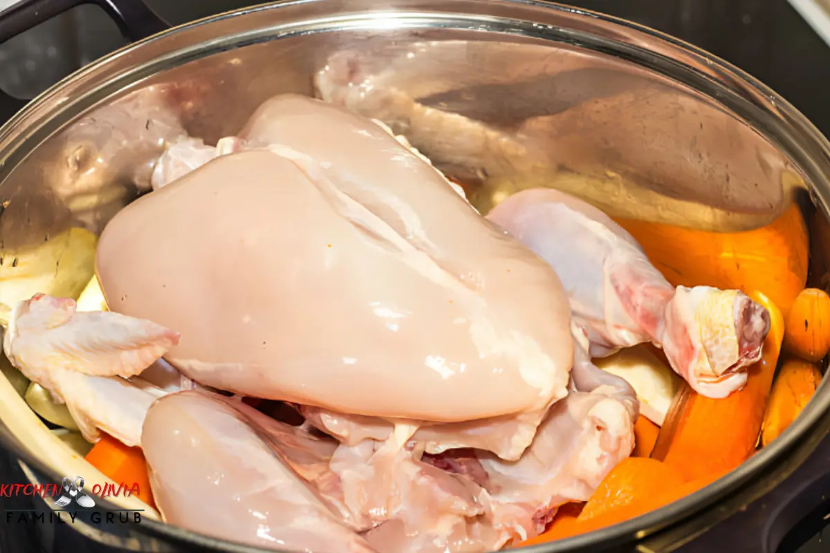 A chef expertly preparing chicken souse in a traditional kitchen.