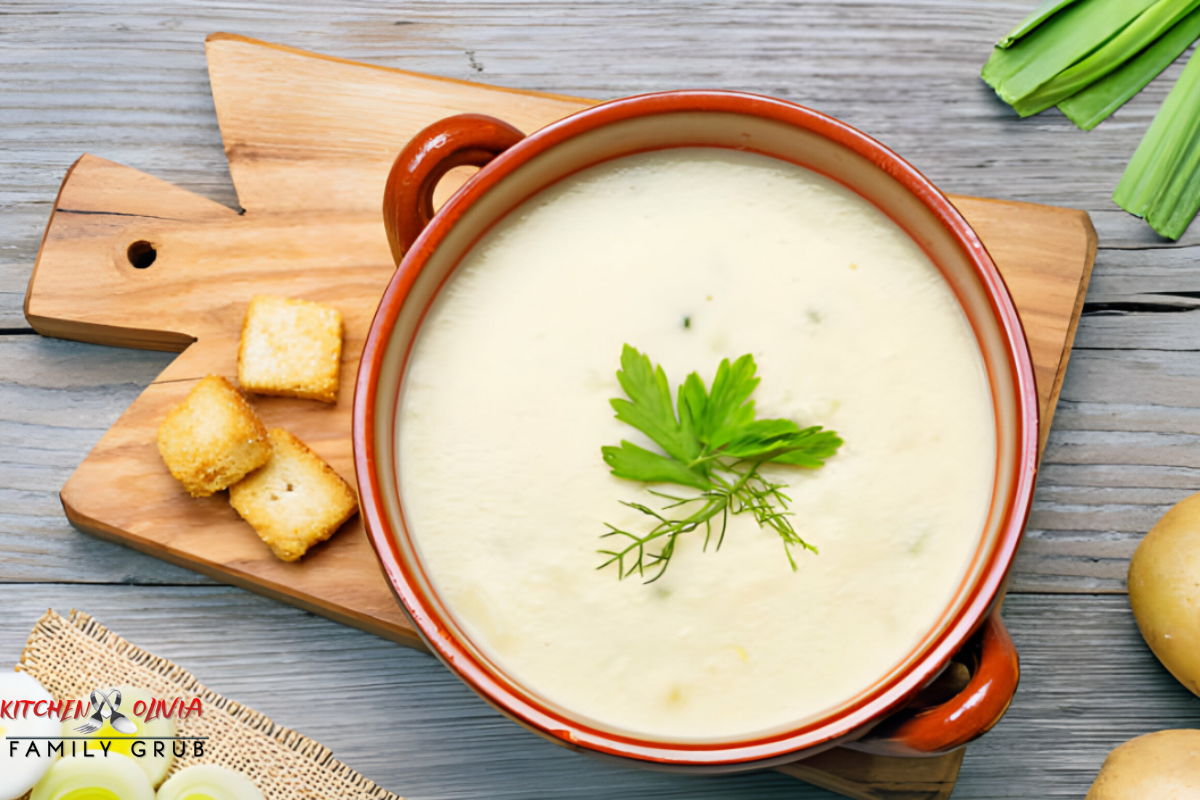 Bowl of homemade onion soup garnished with herbs