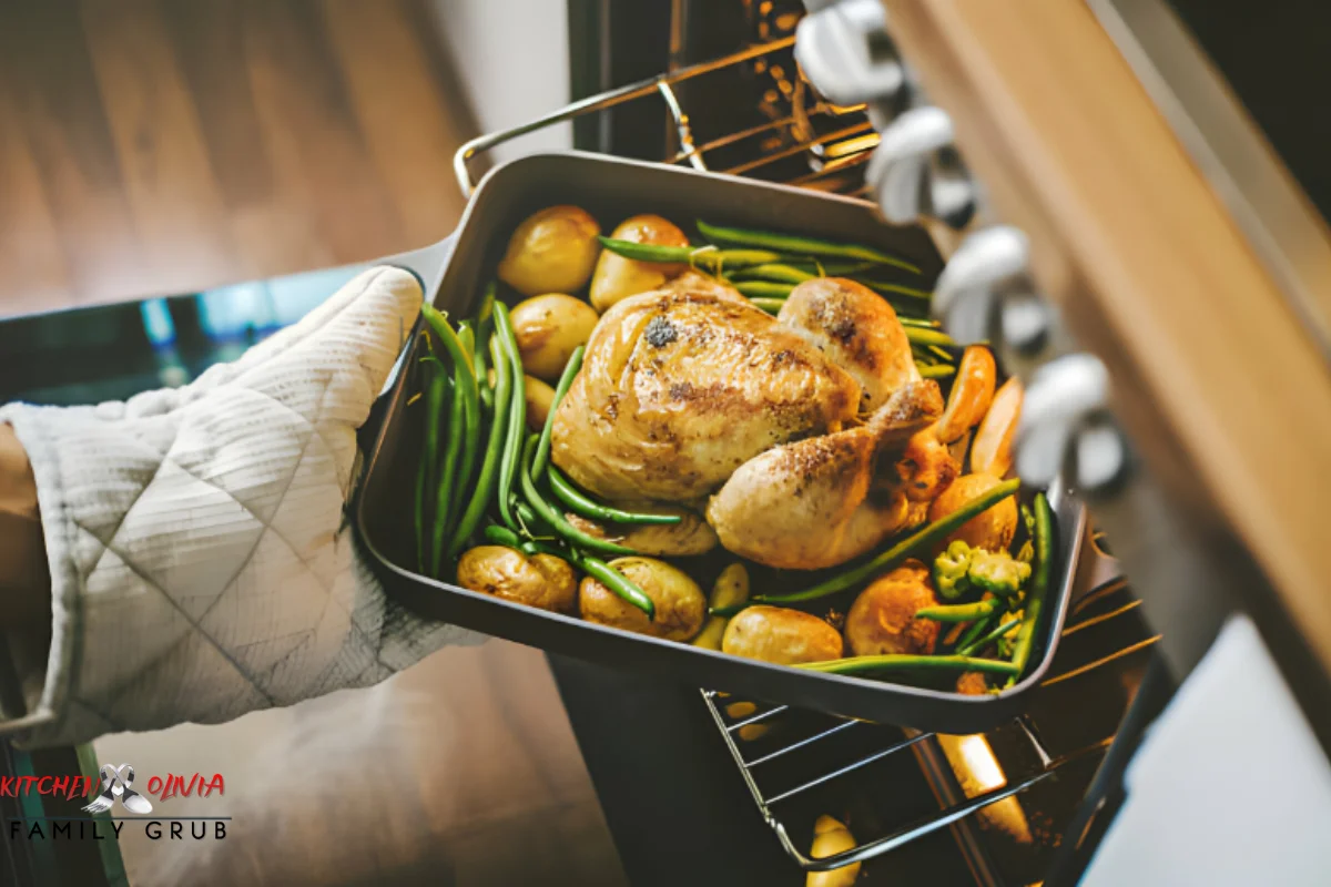 Assorted kitchen utensils for cooking chicken on a countertop